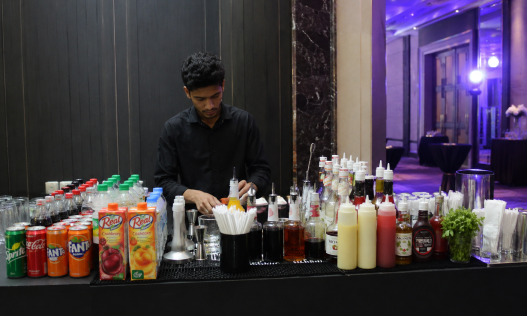 image of a person doing a bar set up garnsihes and so on 