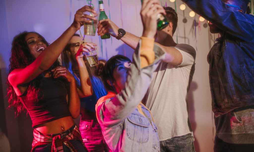 a group of people enjoying the the event with drinks
