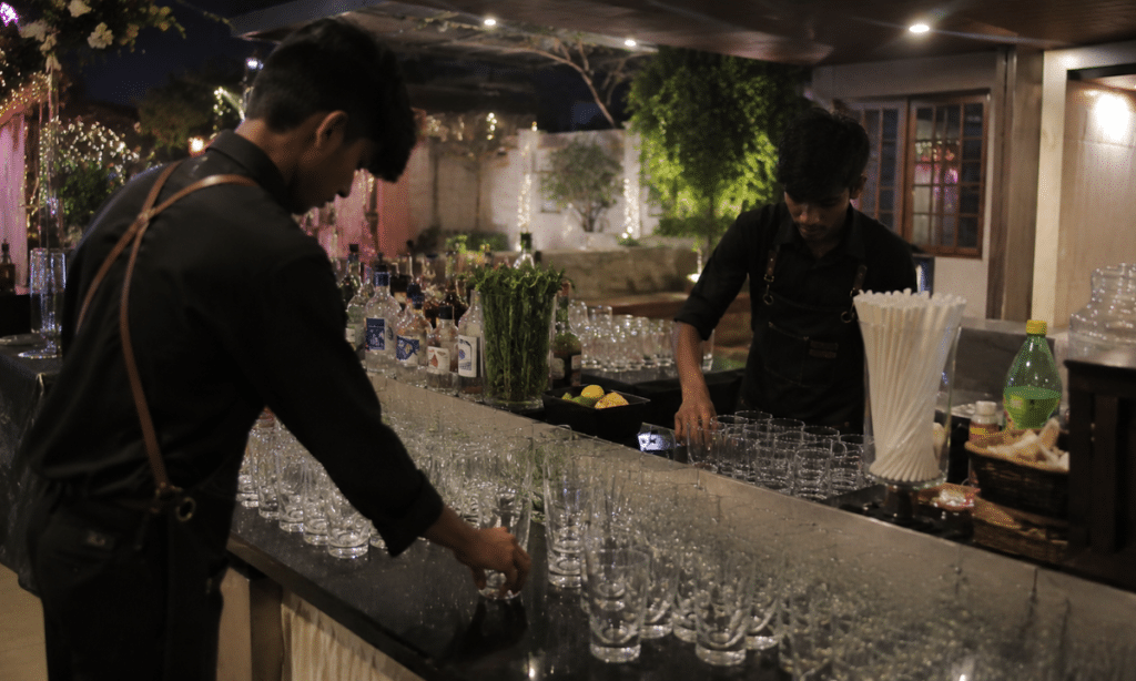a team of bartender arranging and setting up for drinks